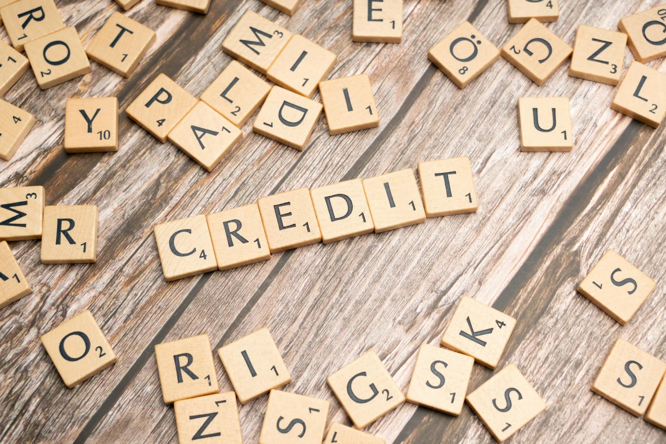 Scrabble letter tiles forming the word "credit".