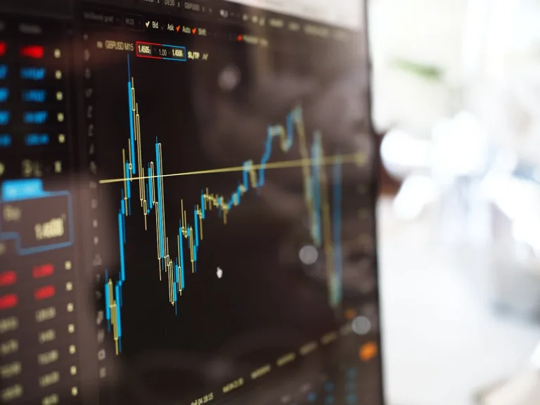 A screen showing a line graph showing stock market fluctuations